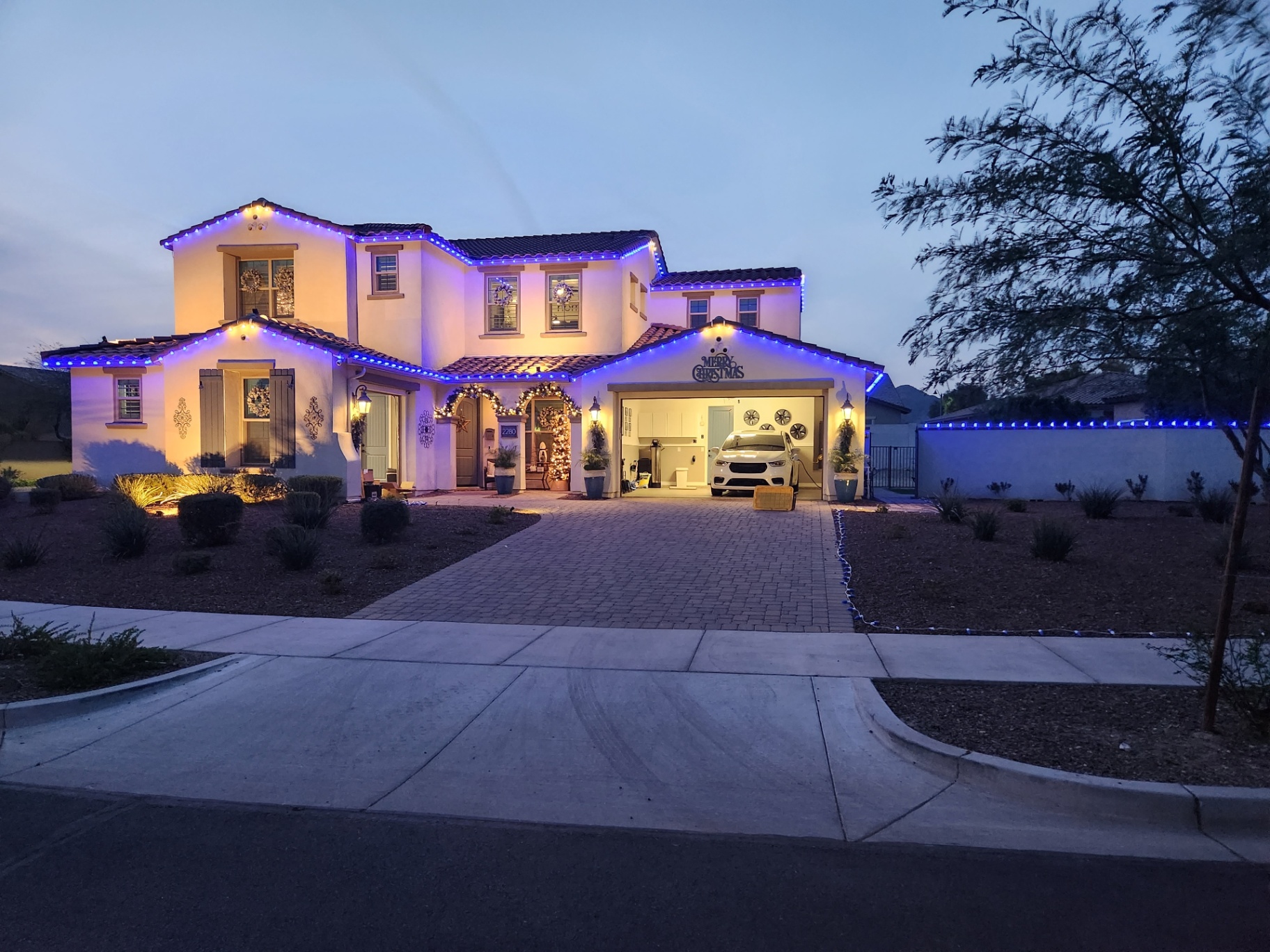 Two-story roofline installation in electric blue — Peoria